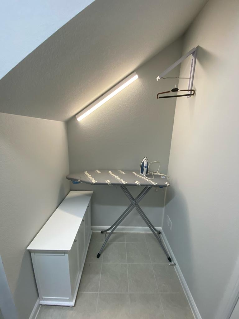 Utilize space under your stairways  as ironing station 